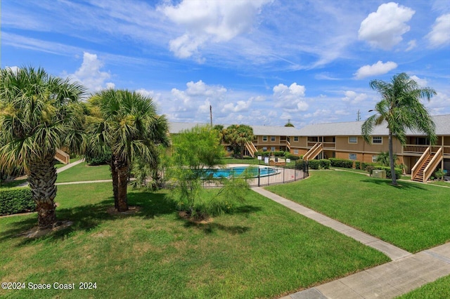 250 Berkshire Ln, Melbourne, FL 32935 - outdoor pool with a yard and stairway