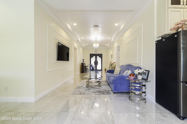 interior space with marble finish floor, baseboards, and ornamental molding