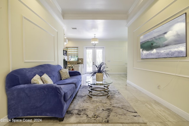 living area with french doors, visible vents, crown molding, and baseboards