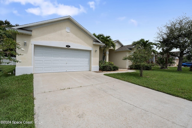 ranch-style house featuring a garage and a front yard