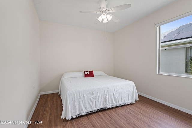 bedroom featuring wood-type flooring and ceiling fan