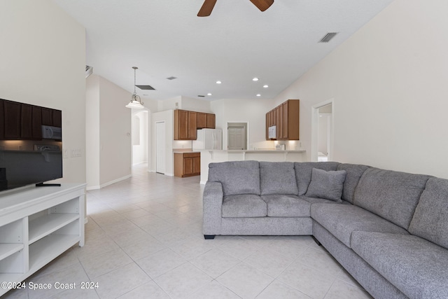 living room with ceiling fan and light tile patterned floors