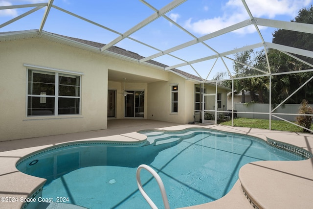 view of pool with a lanai and a patio area