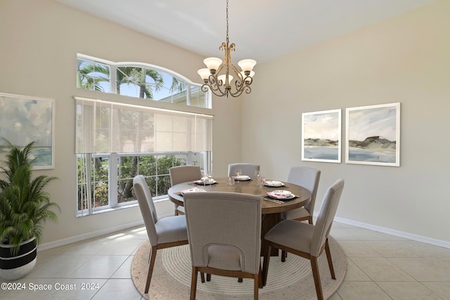 dining area with a chandelier and light tile patterned floors