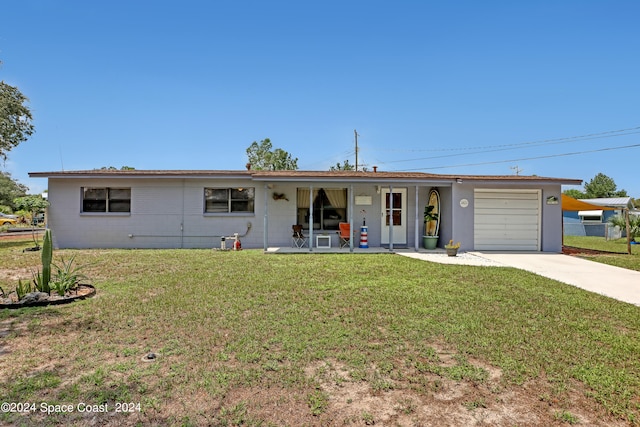 ranch-style home with a garage and a front yard