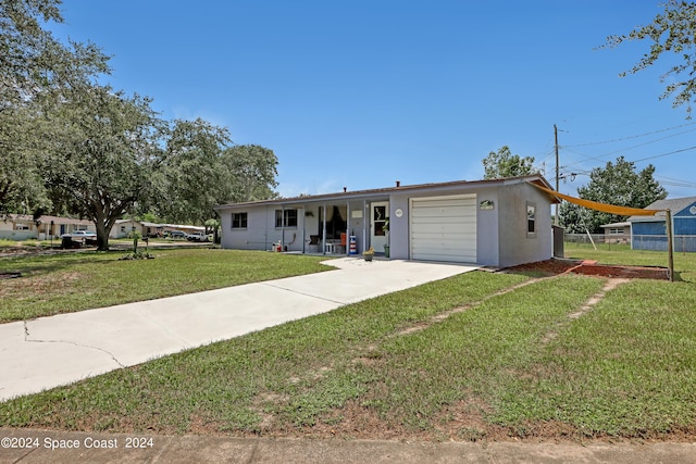 ranch-style home featuring a garage and a front yard