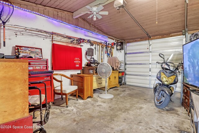 garage featuring a garage door opener and ceiling fan