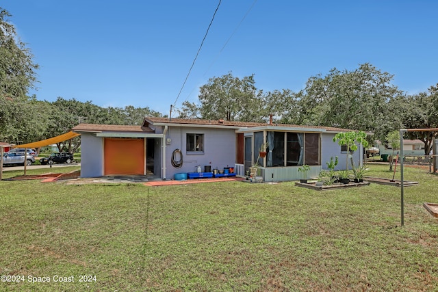 rear view of house with a yard