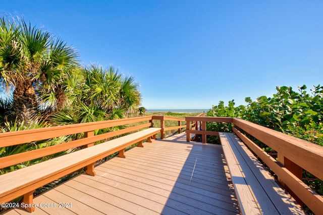 wooden terrace with a water view