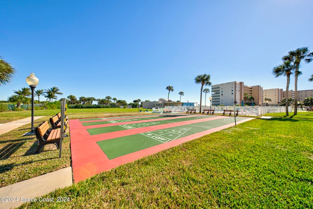 view of home's community with a yard