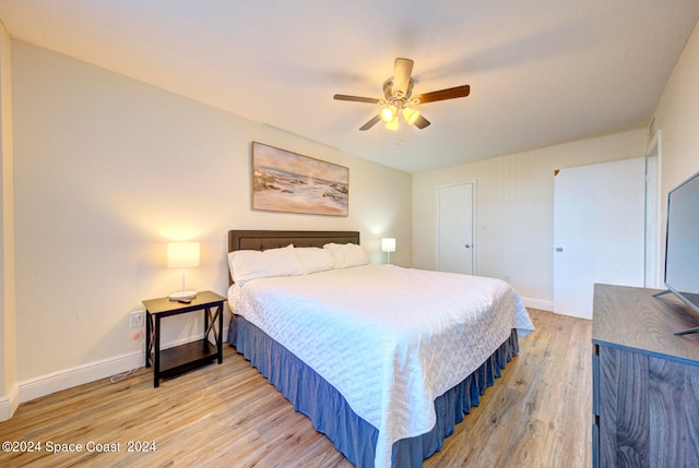 bedroom with light wood-type flooring and ceiling fan