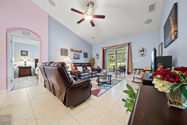 living room with high vaulted ceiling, light tile patterned floors, and ceiling fan