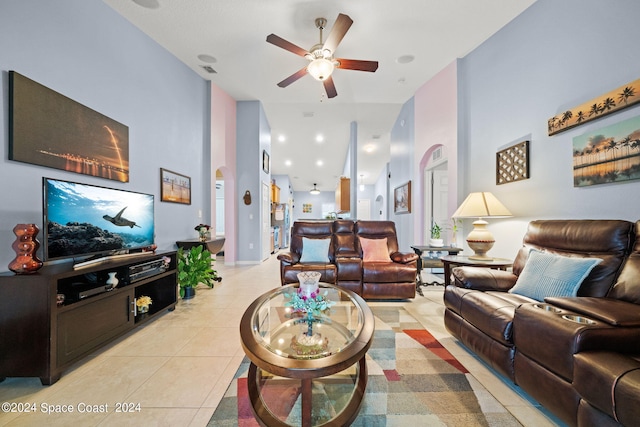 living room with ceiling fan and light tile patterned floors