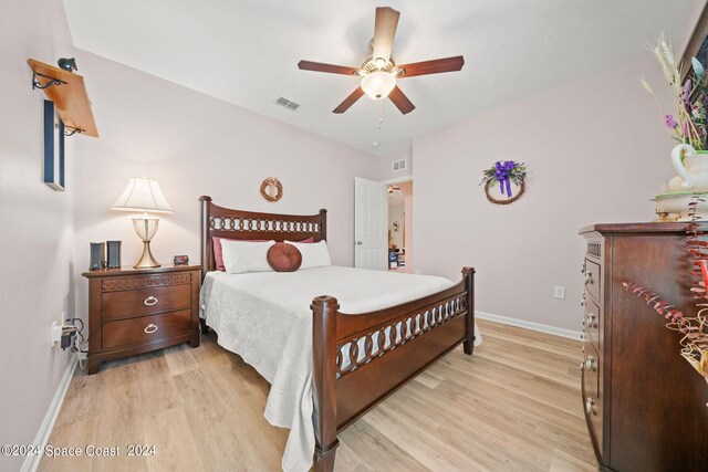 bedroom featuring ceiling fan and light hardwood / wood-style flooring