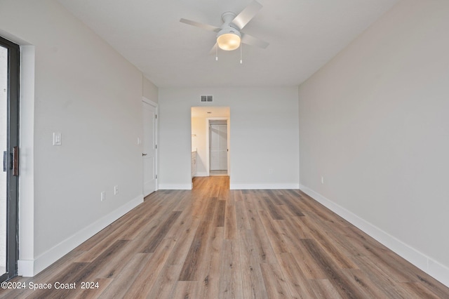 unfurnished room featuring ceiling fan and hardwood / wood-style flooring