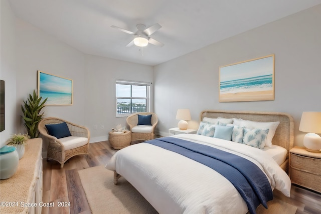 bedroom with wood-type flooring and ceiling fan