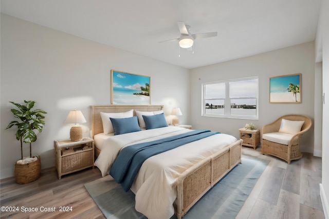 bedroom featuring hardwood / wood-style floors and ceiling fan