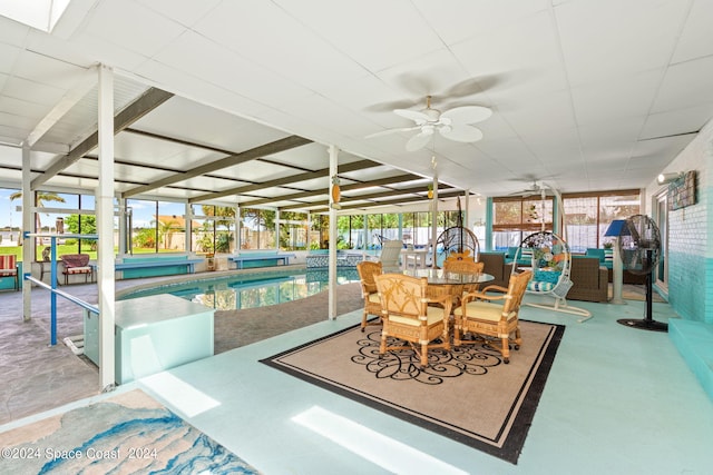 interior space with ceiling fan and a pool