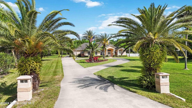 view of property's community with a lawn