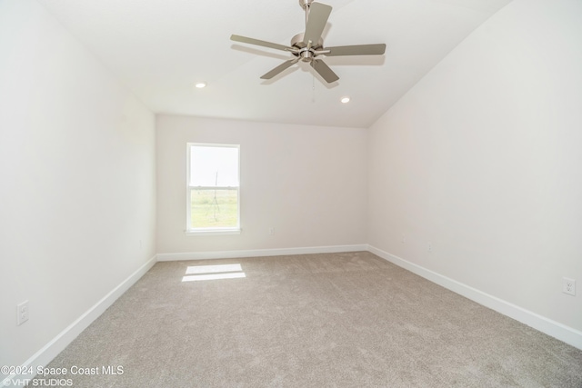 empty room with recessed lighting, baseboards, a ceiling fan, and light carpet