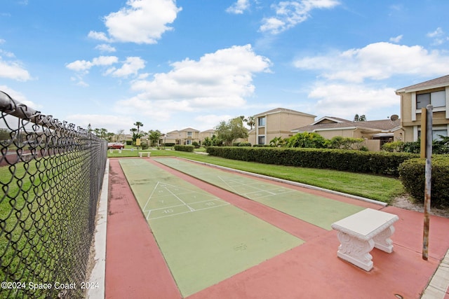 view of home's community with a lawn