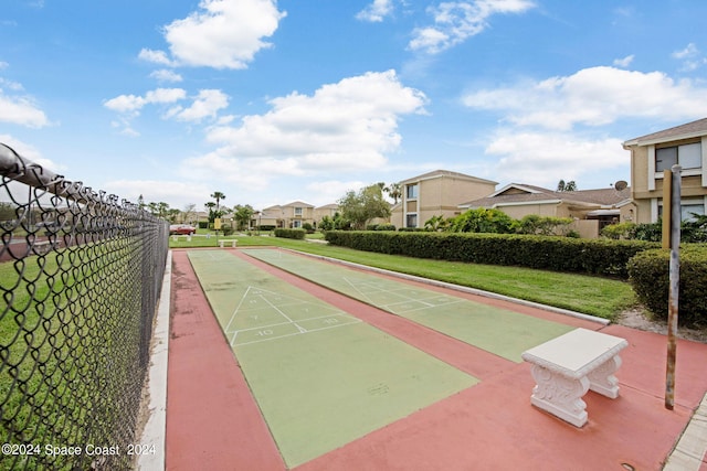 1030 Abada Ct NE Unit 102, Palm Bay, FL 32905 - view of home's community featuring shuffleboard and a residential view