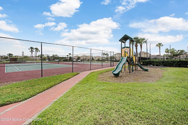 exterior space featuring a playground and a yard