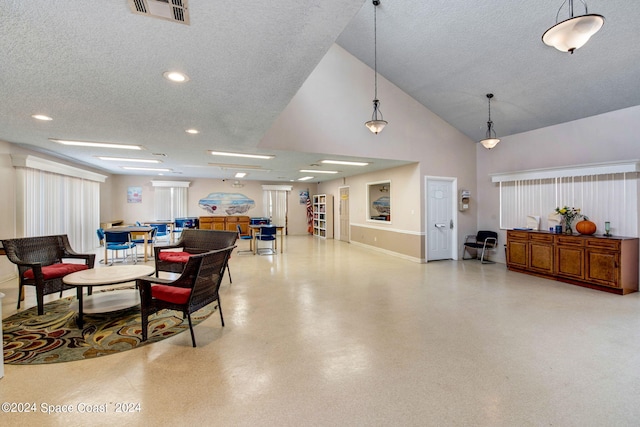 1030 Abada Ct NE Unit 102, Palm Bay, FL 32905 - common area featuring a textured ceiling, high vaulted ceiling, and recessed lighting