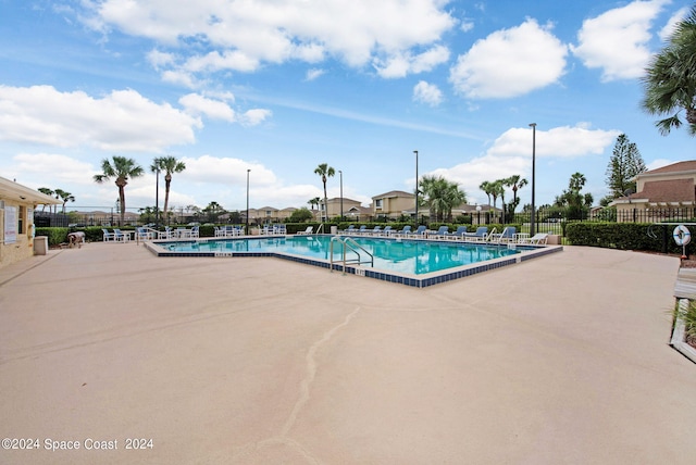 view of swimming pool featuring a patio