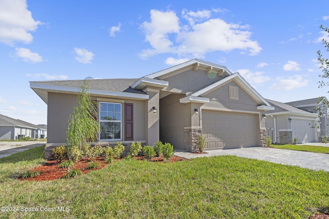 view of front of house featuring a front yard and a garage