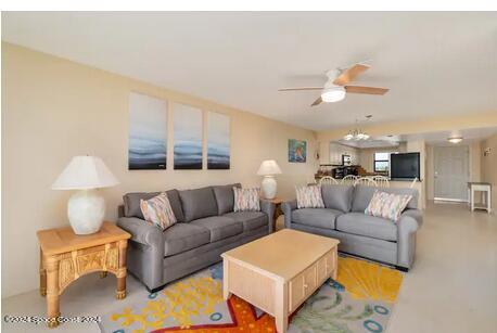 living room featuring ceiling fan