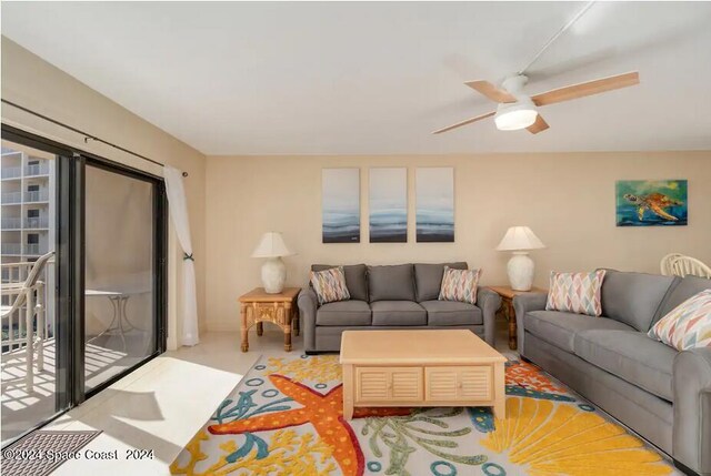 living room featuring light colored carpet and ceiling fan