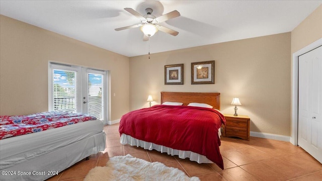 tiled bedroom featuring a closet, ceiling fan, and access to exterior