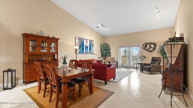 dining space with lofted ceiling