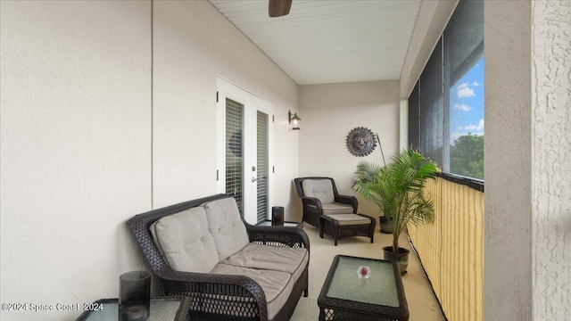 sunroom featuring ceiling fan