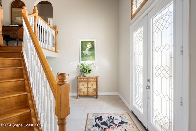 5280 95th St, Sebastian, FL 32958 - entryway featuring healthy amount of natural light, light tile patterned floors, and stairway