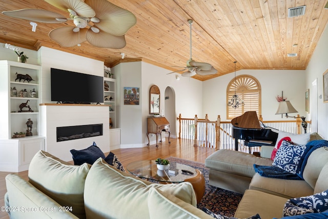 5280 95th St, Sebastian, FL 32958 - living room with ceiling fan, wood ceiling, wood finished floors, arched walkways, and lofted ceiling