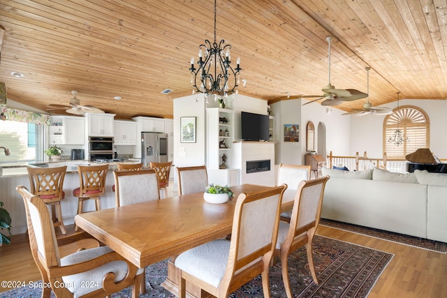 5280 95th St, Sebastian, FL 32958 - dining area featuring wooden ceiling, ceiling fan, lofted ceiling, light wood-style floors, and arched walkways