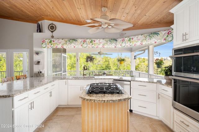 5280 95th St, Sebastian, FL 32958 - kitchen featuring wood ceiling, a ceiling fan, stainless steel appliances, light tile patterned flooring, and crown molding