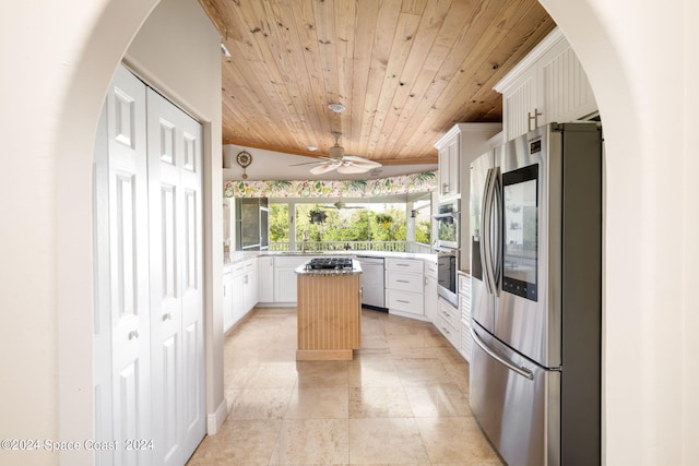 5280 95th St, Sebastian, FL 32958 - kitchen featuring wooden ceiling, stainless steel appliances, a center island, light countertops, and white cabinetry