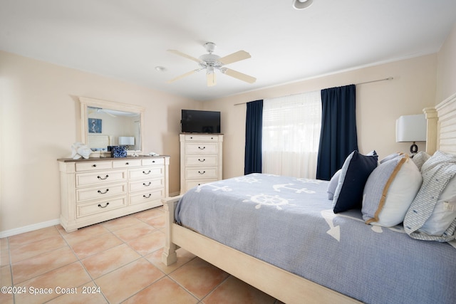 5280 95th St, Sebastian, FL 32958 - bedroom featuring light tile patterned flooring and a ceiling fan