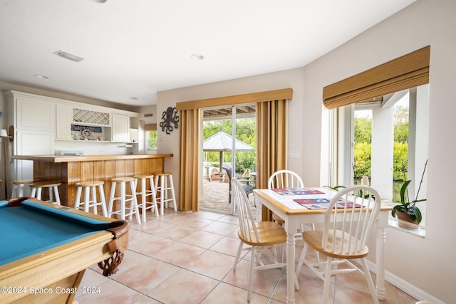 5280 95th St, Sebastian, FL 32958 - dining space with bar with sink, light tile patterned floors, and billiards table