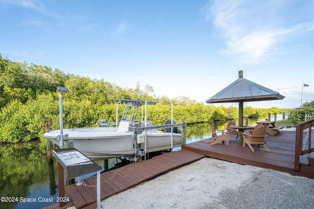5280 95th St, Sebastian, FL 32958 - dock with boat lift, a water view, and a gazebo