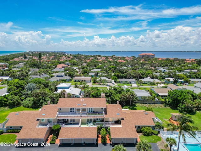 drone / aerial view with a water view