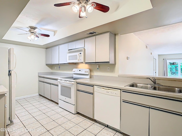 kitchen with light tile patterned floors, light countertops, visible vents, a ceiling fan, and white appliances