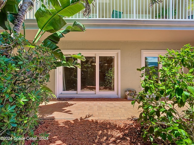 entrance to property with a patio area