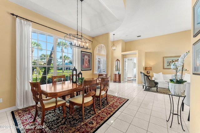 dining room featuring an inviting chandelier and light tile patterned flooring