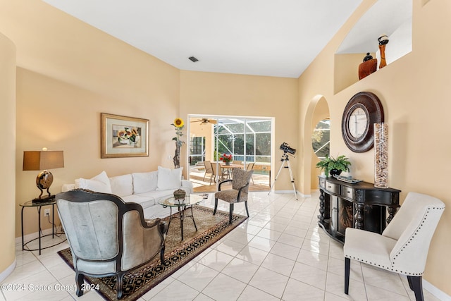 tiled living room featuring ceiling fan