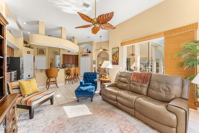 living room featuring ceiling fan and light tile patterned flooring