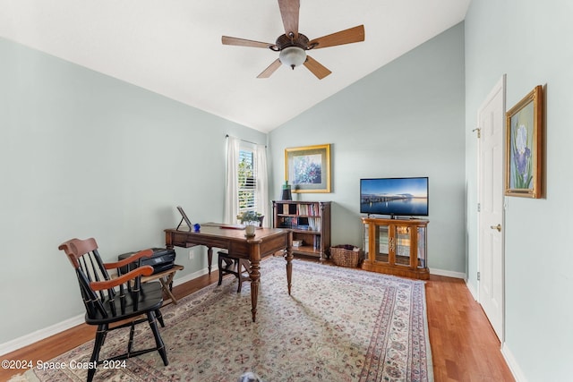 office space featuring high vaulted ceiling, ceiling fan, and light wood-type flooring